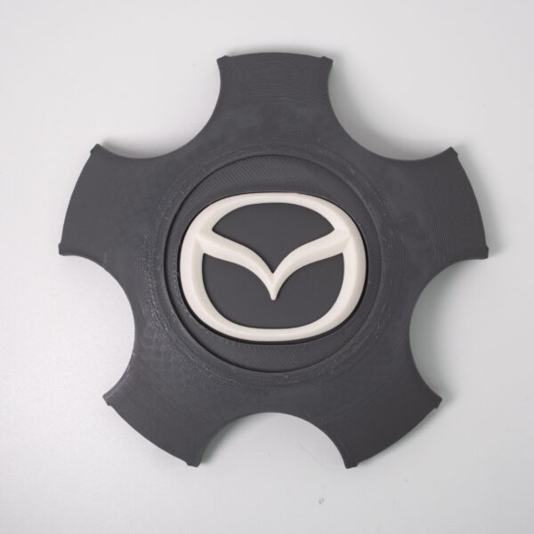 Tapabujes Mazda 6 color gris logo blanco. 4 unidades - Imagen 2